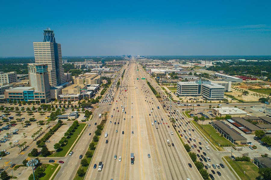 Katy TX - Aerial View of Commercial Buildings Along a Busy Highway in Katy Texas on a Sunny Day